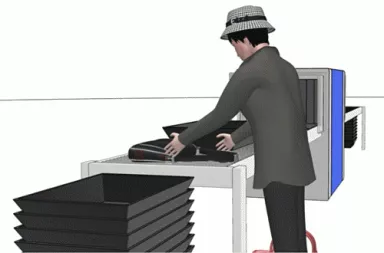 Image d'une personne déposant ses effets personnels dans un bac pour contrôle